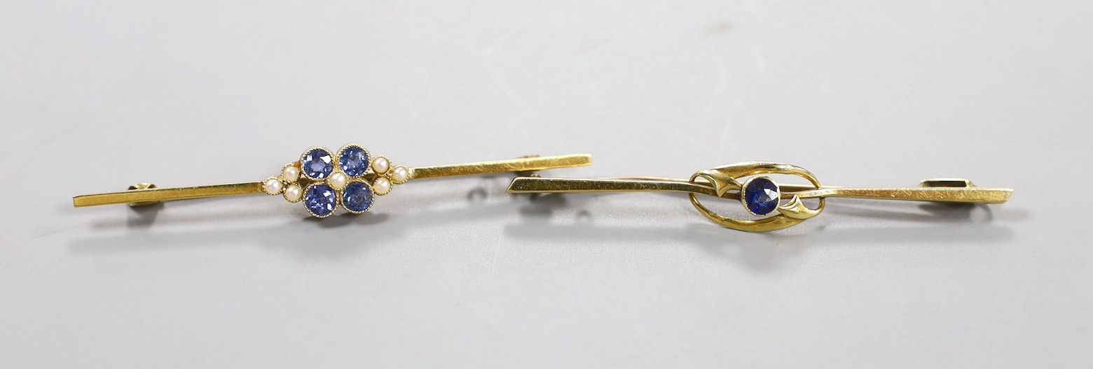 Two Edwardian 15ct bar brooches, one set with a sapphire, the other with sapphire and seed pearls 59mm, gross weight 5.8 grams.